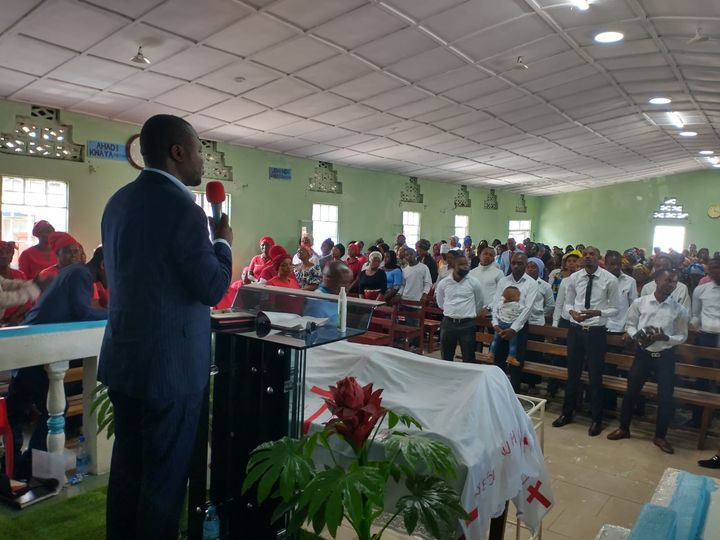 Bishop Faustin preaching to congregation in DR Congo